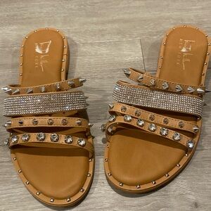 Studded flat sandal by Nicole Miller